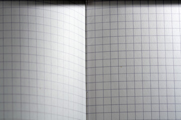 Paper made from wood into writing utensils, bound, checkered and colored