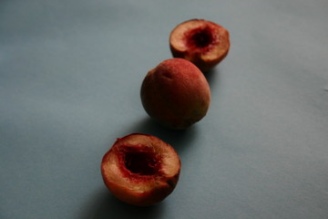 the peaches on the blue background