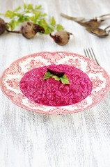beetroot risotto. in a beautiful porcelain English plate