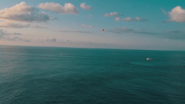 Parashute and motor boat in the ocean