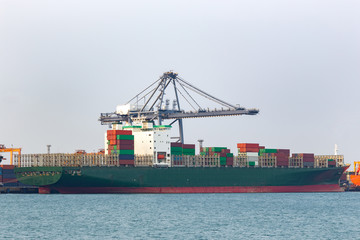 Fototapeta premium Industrial Container Cargo freight ship at habor for Logistic Import Export