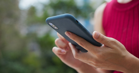 Woman use of cellphone at outdoor