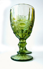 gren glass of wine on white background