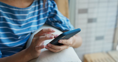 Woman use of cellphone at home
