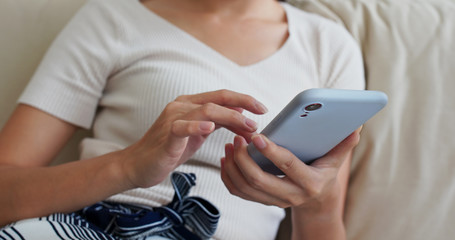 Woman use of smart phone at home