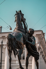 Figures of the klodt horses on Anichkov bridge in st. Petersburg on a summer sunny day.