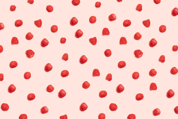 Pattern of juicy ripe raspberries on a pink background. Can be used for blog, poster or web banner.