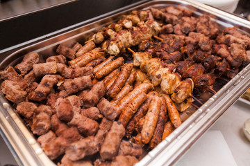 Tasty grilled mix meat, serving on event dish at party