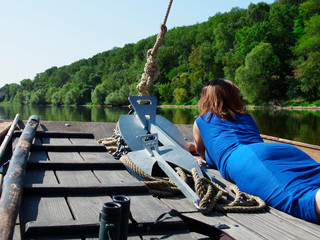 girl stern of a pleasure boat during a boat trip on the Loire River