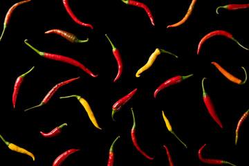 fresh chili peppers on black background