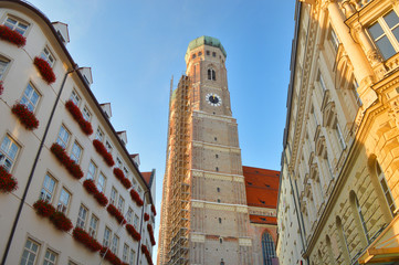 Towers of the Church of Our Lady in Munich, Germany. Frauenkirche towers surrounded by medieval buildings