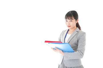 オフィスでファイルを持つ若いビジネスウーマン