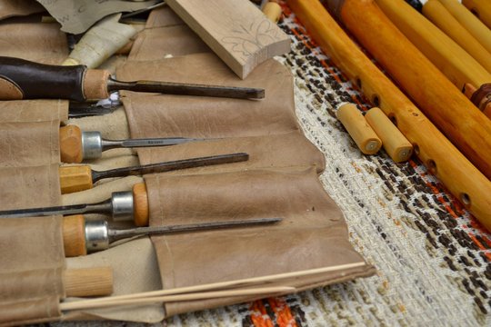 Tools for whistles making  placed in leather cover.