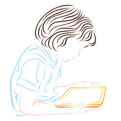 The child looks at the tablet screen