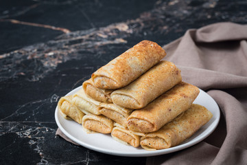 Savory crepes with rice and turkey meat.