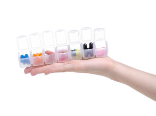 organizer for pills in hand on white background isolation