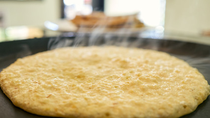 cachapas on a hot plate being prepared. corn pancakes