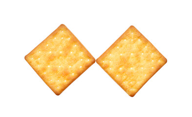 stack of square crackers isolated on white background. Dry cracker cookies isolated