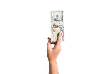 Isolated image of female hand holding a bundle of dollars on white background. Top view of payment concept