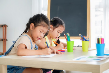 Girls doing homework at classroom