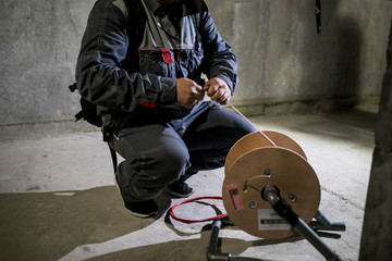 The technician attaching fiber optic on the Optical Distribution Frame. Man working in network...