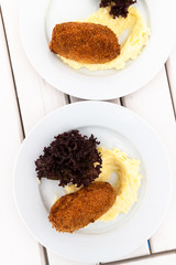 The Breaded cutlet with a mashed potatoes