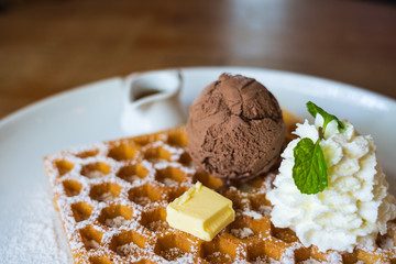 chocolate ice cream, soft cream, cheese on waffle in the white plate