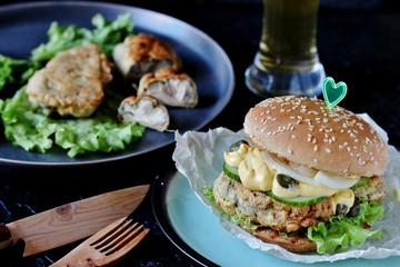 Brain Burger. Fried brains beef, calf or sheep are fried in deep fried as a cutlet in a burger. lettuce, cheese sauce, fresh cucumber and capers. fashionable exotic food. weird food