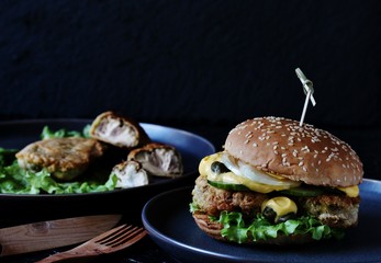 Brain Burger. Fried brains beef, calf or sheep are fried in deep fried as a cutlet in a burger. lettuce, cheese sauce, fresh cucumber and capers. fashionable exotic food. weird food