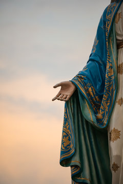 Focus on the hand of the blessed virgin mary,mother of Jesus on the blue sky, in front of the Roman Catholic Diocese, public place in Chanthaburi, Thailand.