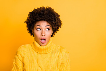 Photo of dark skin lady with open mouth afraid to be caught at exam cheating wear warm knitted sweater isolated yellow background
