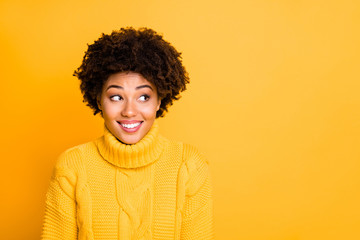 Fototapeta na wymiar Photo of amazing dark skin lady with sweet beaming smile look side on banner wear warm knitted jumper isolated yellow background