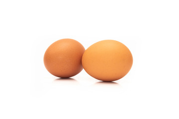 Fresh organic brown eggs isolated in white background with clipping path