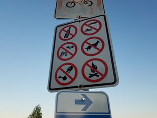 no dogs, drinking, fires, trash, or bikes sign