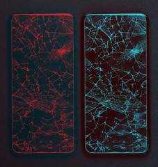 Smartphone with broken protective glass on black background. Glitch effect