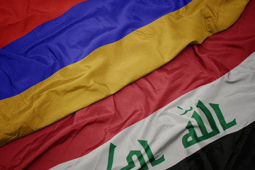 waving colorful flag of iraq and national flag of armenia.