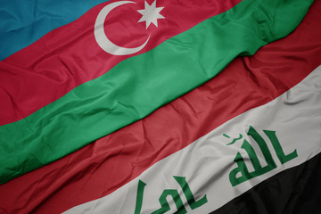 waving colorful flag of iraq and national flag of azerbaijan.