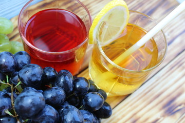 two glasses of fresh juice from different grape varieties