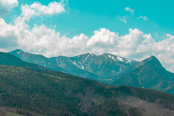 Panorama of beautiful countryside. sunny afternoon. Grassy field and rolling hills. rural scenery