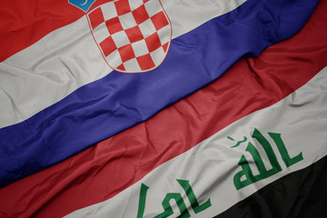 waving colorful flag of iraq and national flag of croatia.