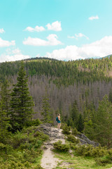 Lifestyle travel adventure outdoor summer vacations tourist with backpack enjoying beautiful view of green hills