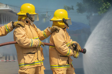 Firefighters training, foreground is drop of water springer, Selective focus.