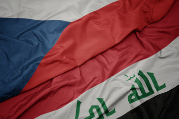 waving colorful flag of iraq and national flag of czech republic.