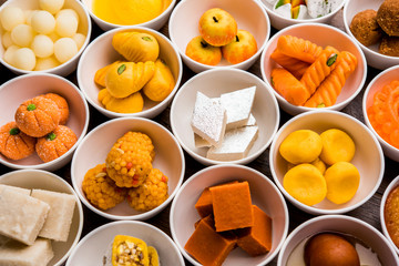 Rangoli of Assorted Indian sweets/mithai in bowl for Diwali or any other festivals, selective focus
