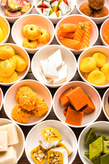 Rangoli of Assorted Indian sweets/mithai in bowl for Diwali or any other festivals, selective focus
