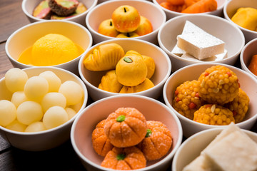 Rangoli of Assorted Indian sweets/mithai in bowl for Diwali or any other festivals, selective focus