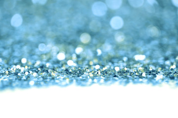 Blue glitter shine dots confetti. Abstract light blink sparkle defocus backgound.