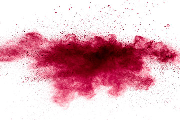 Red powder explosion on white background. Freeze motion of red dust particles splash.