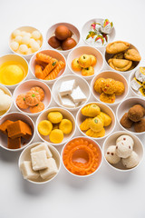 Rangoli of Assorted Indian sweets/mithai in bowl for Diwali or any other festivals, selective focus