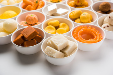 Rangoli of Assorted Indian sweets/mithai in bowl for Diwali or any other festivals, selective focus